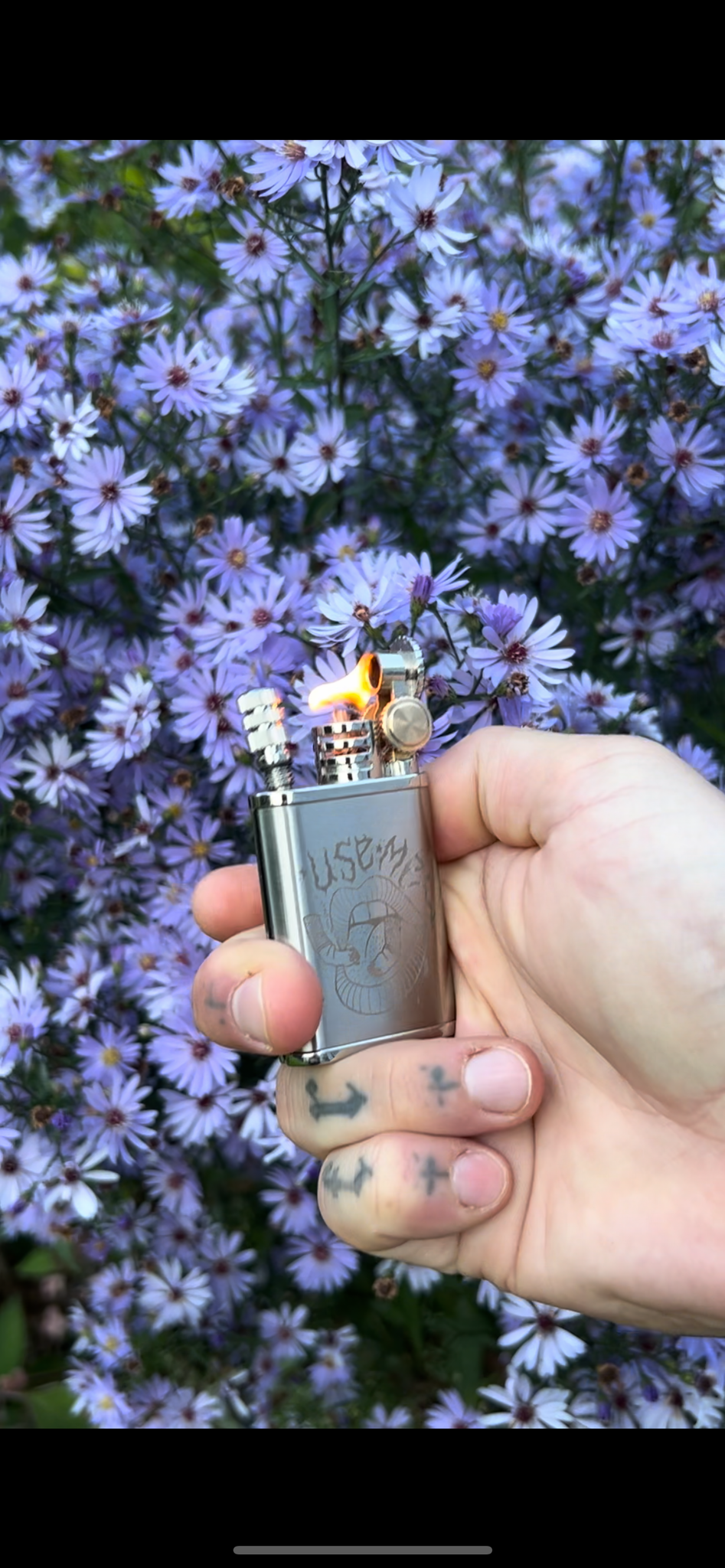 'Use me' fuel lighter with reusable flint match